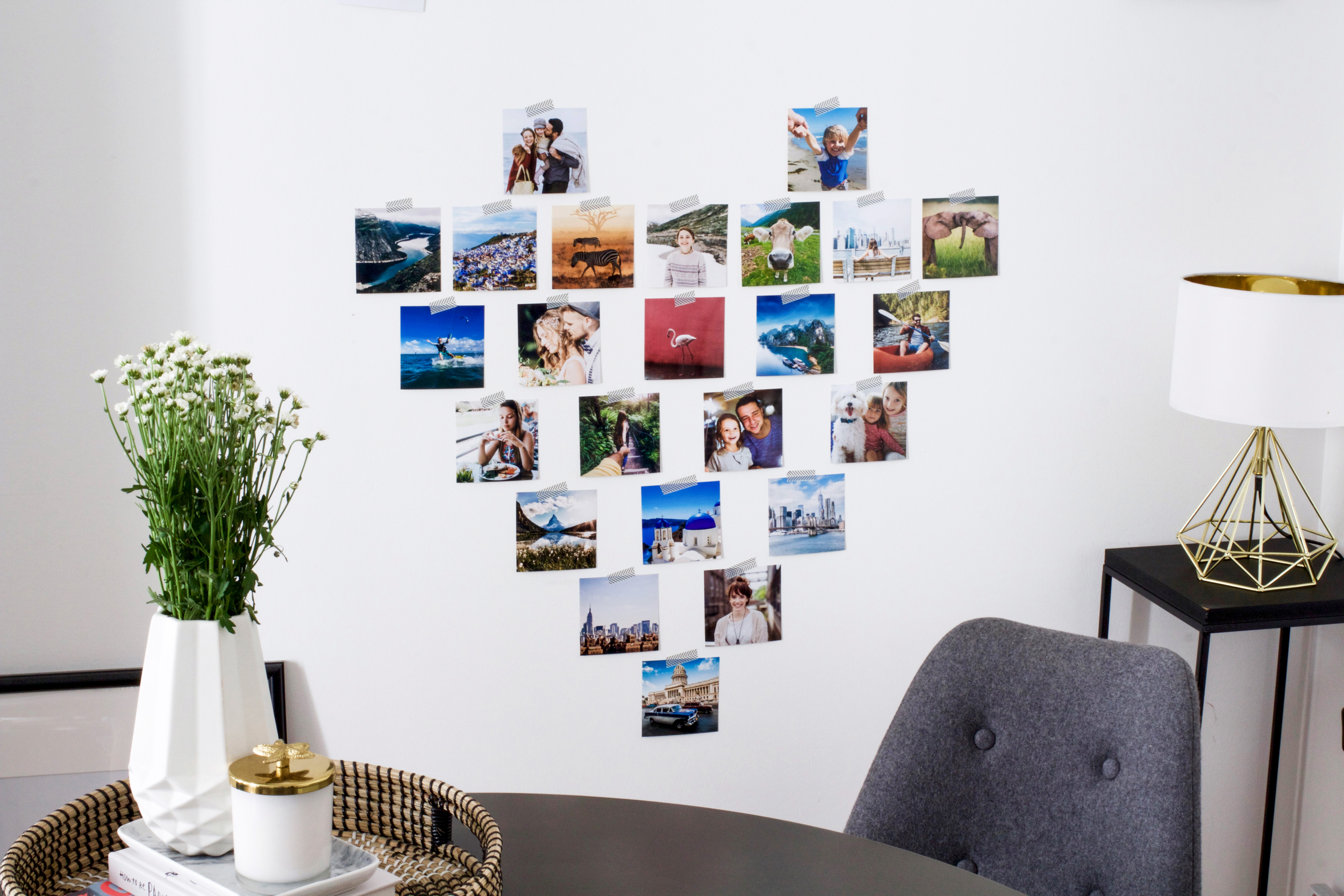 Fotos in Herzform als Collage an die Wand kleben.