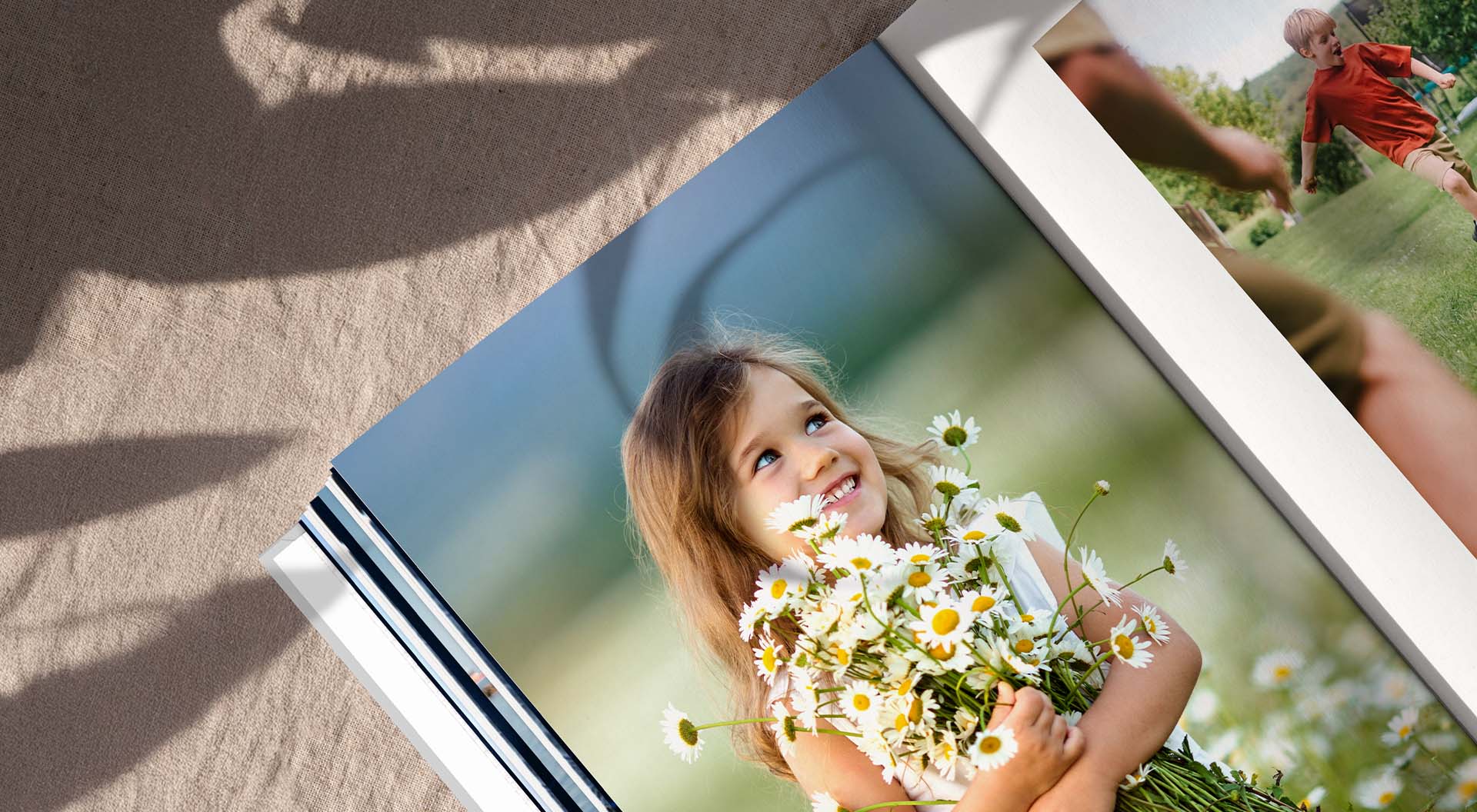 Close-up of a photo book page with image of a girl holding flowers